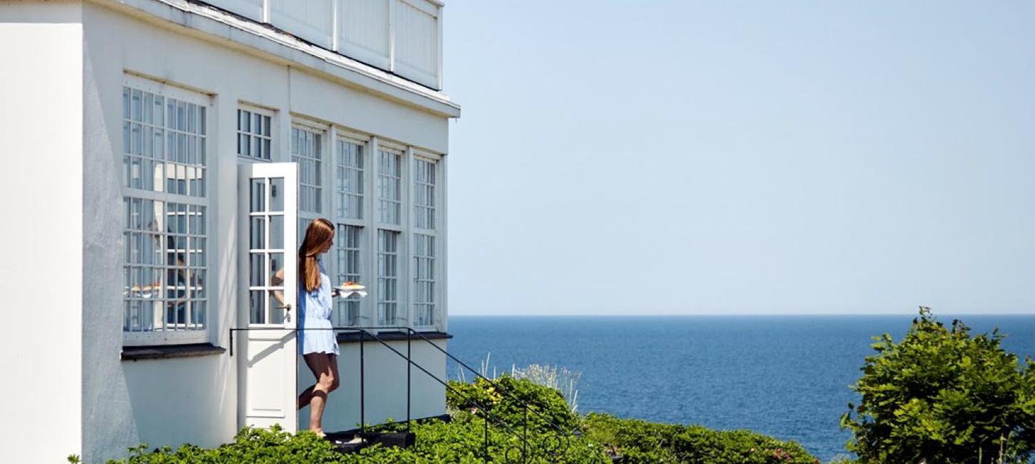 A woman walks out of Helenekilde Badehotel in North Zealand, Denmark